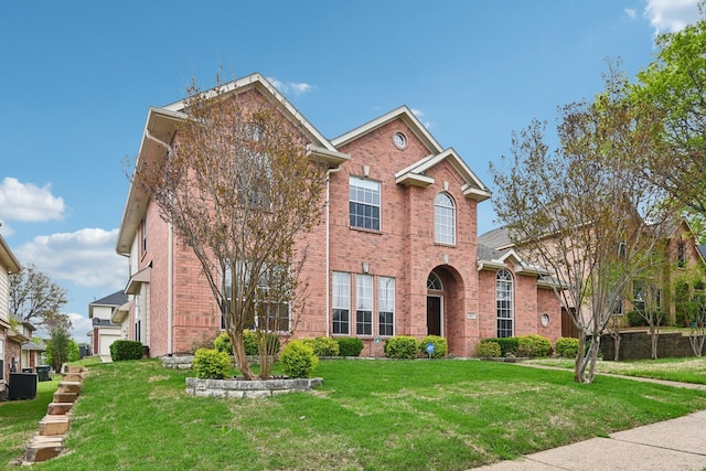 604 Nelson Ct, Plano, TX 75025 - traditional home featuring brick siding, a front yard, and central AC unit