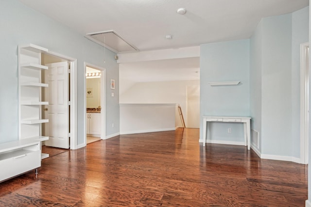 604 Nelson Ct, Plano, TX 75025 - unfurnished living room featuring attic access, wood finished floors, and baseboards