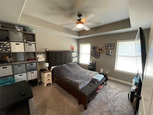 108 Ronnie Ln, Weatherford, TX 76088 - bedroom with a raised ceiling, light colored carpet, baseboards, and ceiling fan