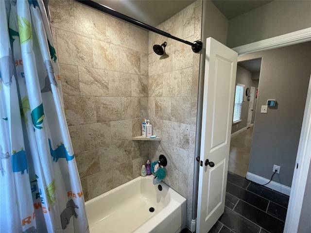 108 Ronnie Ln, Weatherford, TX 76088 - bathroom featuring shower / bathtub combination with curtain, tile patterned flooring, and baseboards
