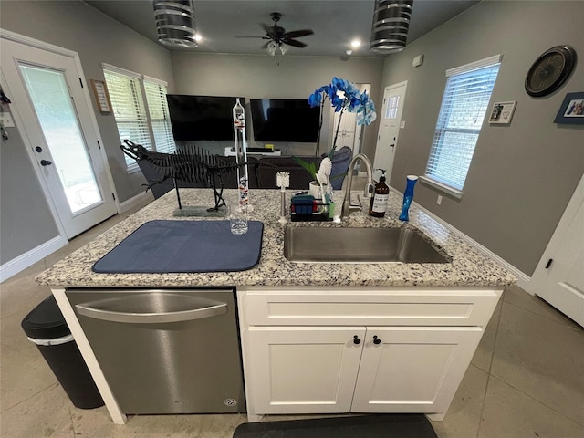 108 Ronnie Ln, Weatherford, TX 76088 - kitchen featuring stainless steel dishwasher, a sink, light stone countertops, and a ceiling fan