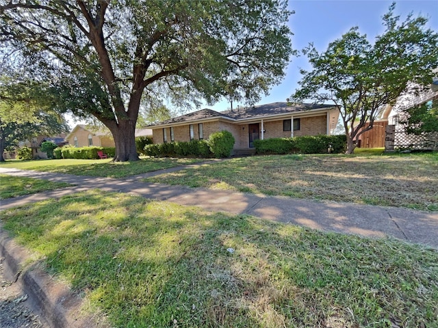 3614 Matador Dr, Garland, TX 75042 - single story home with brick siding and a front lawn