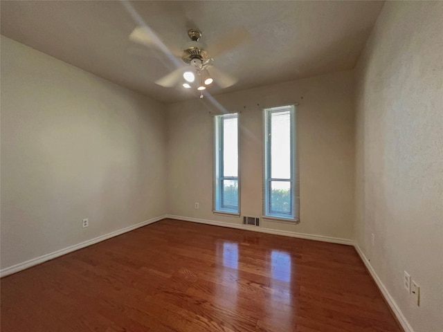 3614 Matador Dr, Garland, TX 75042 - unfurnished room with wood finished floors, a ceiling fan, and baseboards