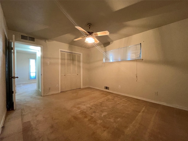 3614 Matador Dr, Garland, TX 75042 - unfurnished bedroom with carpet, baseboards, a closet, and a ceiling fan