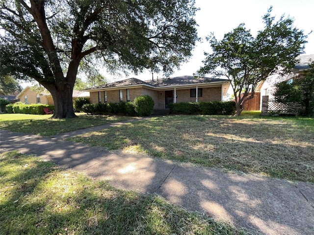3614 Matador Dr, Garland, TX 75042 - ranch-style home featuring brick siding and a front lawn