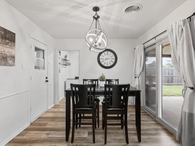 110 N Willow St, Mansfield, TX 76063 - dining area featuring a chandelier and wood finished floors