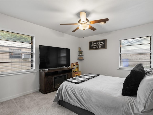 110 N Willow St, Mansfield, TX 76063 - bedroom with multiple windows, light colored carpet, ceiling fan, and baseboards