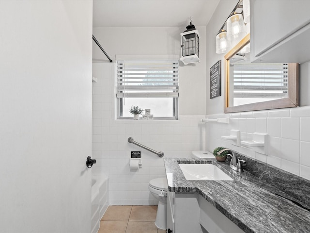 110 N Willow St, Mansfield, TX 76063 - full bath featuring tile walls, tile patterned flooring, toilet, shower / washtub combination, and vanity
