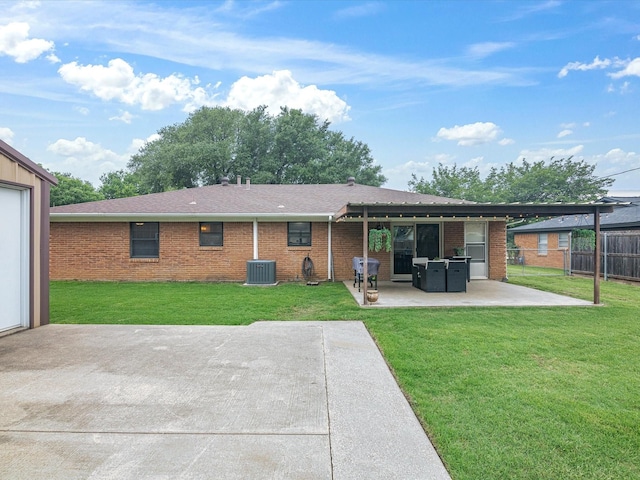 110 N Willow St, Mansfield, TX 76063 - back of property featuring a patio area, central air condition unit, brick siding, and roof with shingles