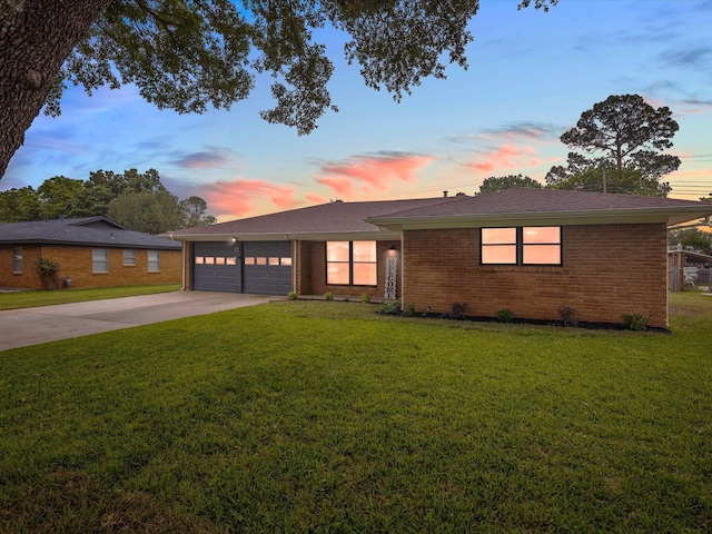 110 N Willow St, Mansfield, TX 76063 - view of front facade featuring driveway, an attached garage, a yard, and brick siding