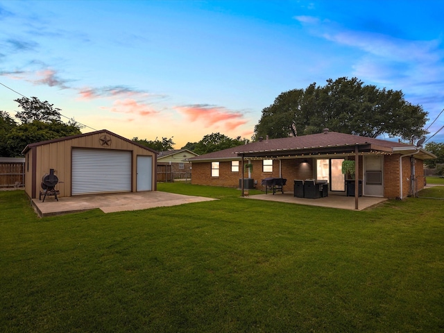 110 N Willow St, Mansfield, TX 76063 - yard at dusk featuring an outdoor structure, a patio area, a detached garage, and cooling unit