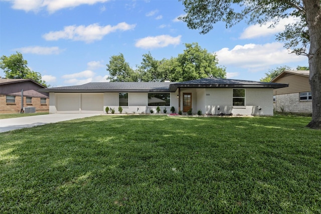 5009 Stacey Ave, Fort Worth, TX 76132 - view of front of property with concrete driveway, a garage, a front yard, and central AC unit
