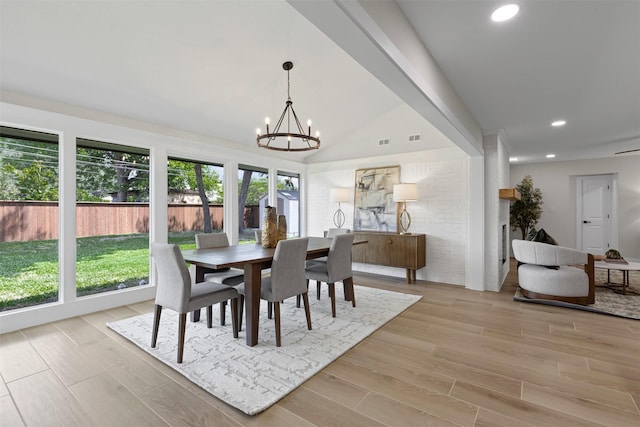 5009 Stacey Ave, Fort Worth, TX 76132 - dining room with a chandelier, recessed lighting, light wood-type flooring, and vaulted ceiling