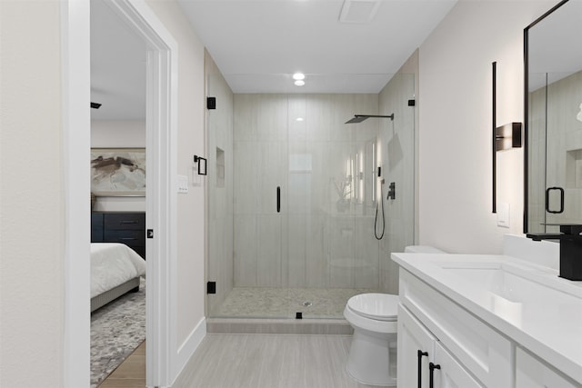 5009 Stacey Ave, Fort Worth, TX 76132 - full bathroom with vanity, a shower stall, wood finished floors, and toilet