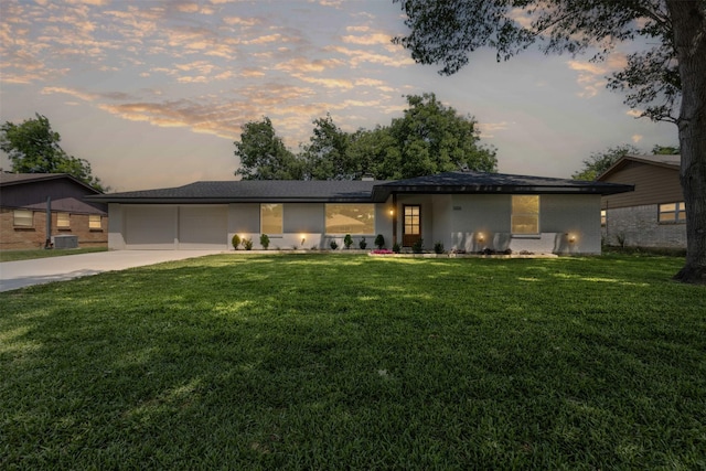 5009 Stacey Ave, Fort Worth, TX 76132 - ranch-style house with driveway, a garage, central AC unit, a yard, and brick siding
