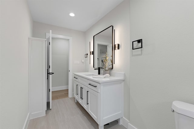 5009 Stacey Ave, Fort Worth, TX 76132 - bathroom with vanity, baseboards, toilet, and recessed lighting