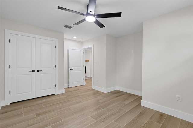 5009 Stacey Ave, Fort Worth, TX 76132 - unfurnished bedroom featuring baseboards, light wood-style flooring, a closet, and a ceiling fan
