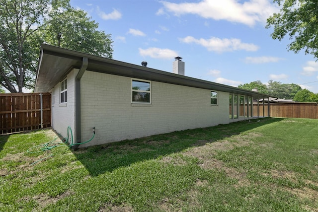 5009 Stacey Ave, Fort Worth, TX 76132 - view of side of home with brick siding and a chimney