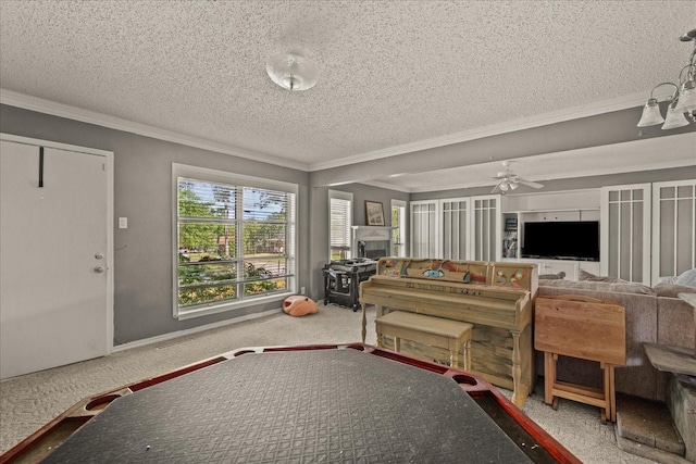5401 Roberts St, Greenville, TX 75402 - living room with ornamental molding, a textured ceiling, ceiling fan, and carpet floors