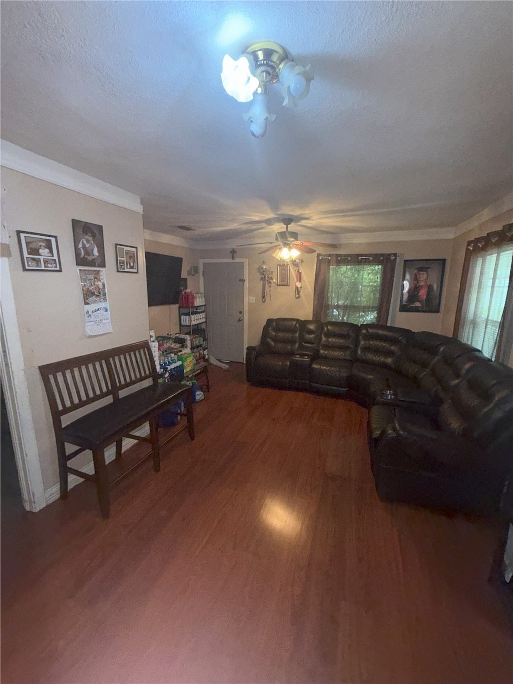 3150 Hale Ave, Fort Worth, TX 76106 - living area featuring ceiling fan, wood finished floors, ornamental molding, and a textured ceiling