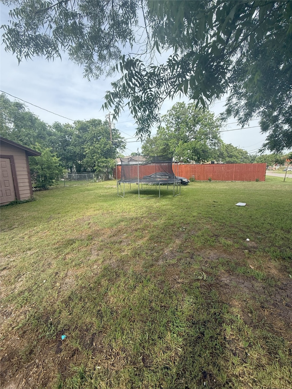 3150 Hale Ave, Fort Worth, TX 76106 - view of yard with a trampoline