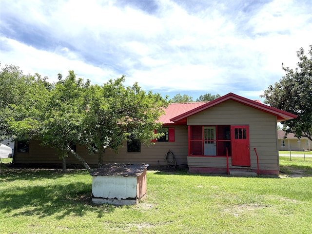 1205 Lamar, Mount Pleasant, TX 75455 - view of front of house featuring a front lawn and metal roof