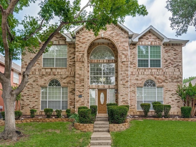 1428 Charlotte Way, Carrollton, TX 75007 - traditional home with brick siding and a front lawn
