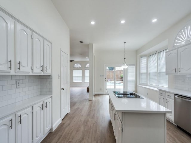 1428 Charlotte Way, Carrollton, TX 75007 - kitchen featuring stainless steel dishwasher, black electric cooktop, a center island, white cabinetry, and recessed lighting