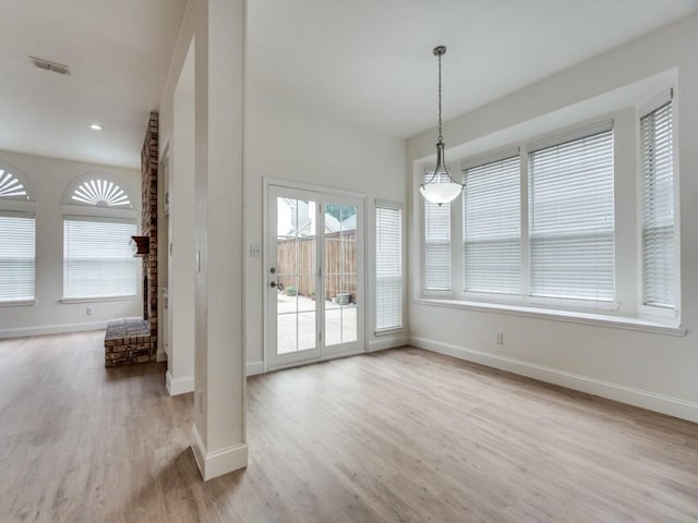1428 Charlotte Way, Carrollton, TX 75007 - unfurnished dining area featuring baseboards and wood finished floors