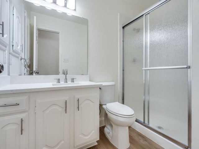 1428 Charlotte Way, Carrollton, TX 75007 - full bath with wood finished floors, toilet, a shower stall, and vanity