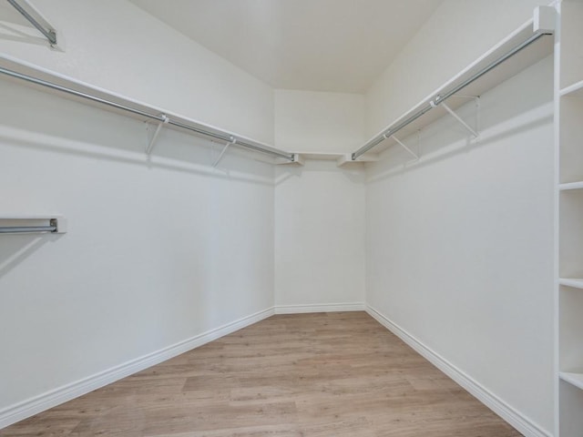 1428 Charlotte Way, Carrollton, TX 75007 - walk in closet featuring wood finished floors