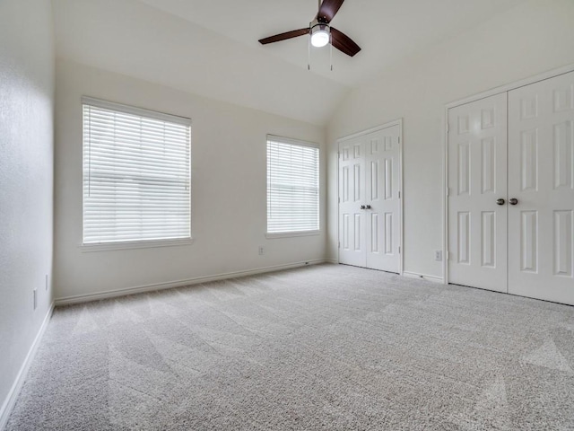 1428 Charlotte Way, Carrollton, TX 75007 - unfurnished bedroom featuring two closets, carpet flooring, vaulted ceiling, and baseboards