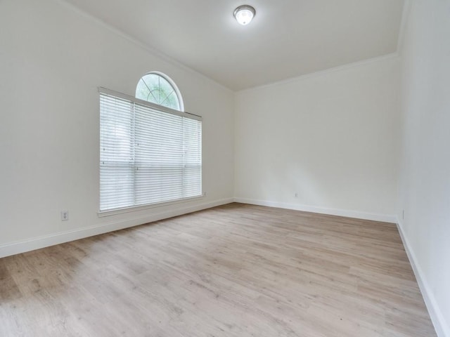 1428 Charlotte Way, Carrollton, TX 75007 - spare room featuring light wood finished floors, baseboards, and crown molding