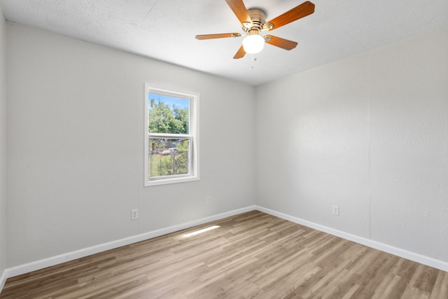 903 1st St, Bridgeport, TX 76426 - spare room featuring light wood finished floors, baseboards, and ceiling fan