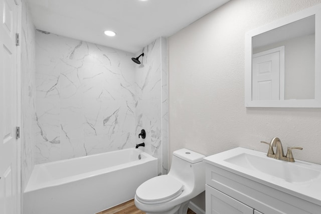 903 1st St, Bridgeport, TX 76426 - bathroom featuring vanity, toilet, washtub / shower combination, wood finished floors, and recessed lighting