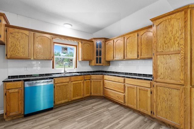 903 1st St, Bridgeport, TX 76426 - kitchen featuring dishwashing machine, a sink, light wood finished floors, tasteful backsplash, and vaulted ceiling
