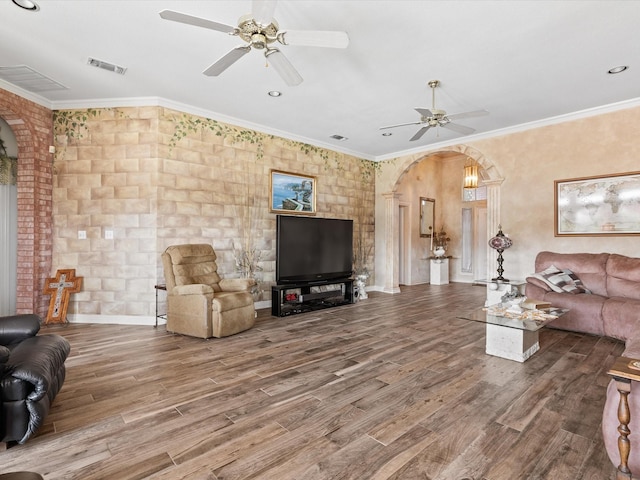 3709 Cliff View Loop, Weatherford, TX 76087 - living area with arched walkways, a ceiling fan, wood finished floors, crown molding, and recessed lighting