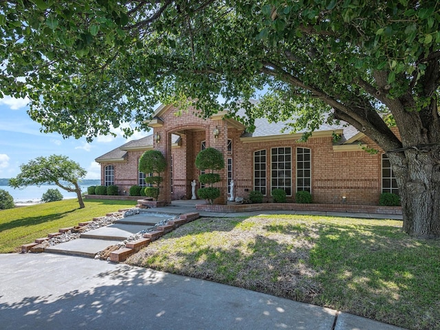 3709 Cliff View Loop, Weatherford, TX 76087 - traditional home featuring brick siding, a front yard, and roof with shingles