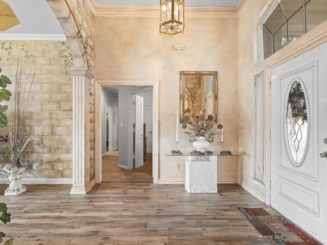 3709 Cliff View Loop, Weatherford, TX 76087 - foyer entrance with wood finished floors, crown molding, decorative columns, baseboards, and a towering ceiling