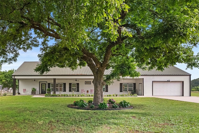 4675 County Road 2216, Caddo Mills, TX 75135 - view of front of property featuring ceiling fan, a garage, driveway, a front yard, and metal roof