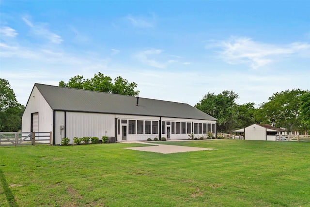 4675 County Road 2216, Caddo Mills, TX 75135 - back of property featuring an outbuilding, a garage, a patio area, and metal roof