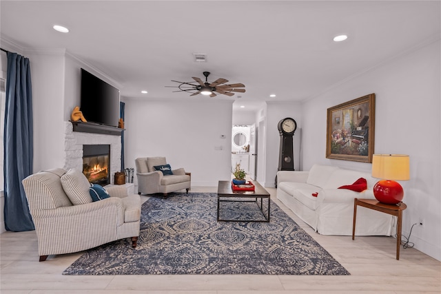 4675 County Road 2216, Caddo Mills, TX 75135 - living area featuring recessed lighting, a stone fireplace, a ceiling fan, wood finished floors, and crown molding