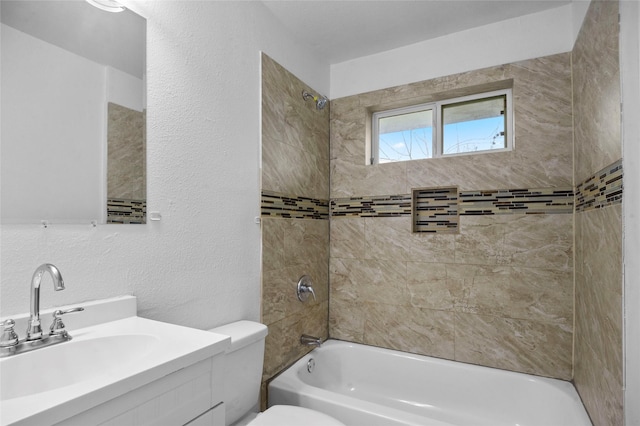 3334 Modlin St, Dallas, TX 75228 - full bath with toilet, vanity, a textured wall, and bathing tub / shower combination