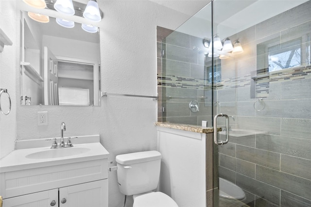 3334 Modlin St, Dallas, TX 75228 - full bathroom featuring a textured wall, toilet, vanity, and a shower stall