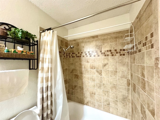 508 Fox Trl, Greenville, TX 75402 - full bathroom featuring shower / tub combo and a textured ceiling