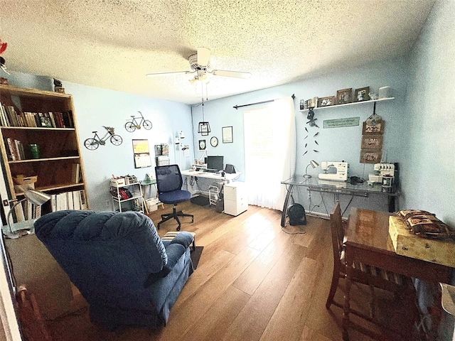 508 Fox Trl, Greenville, TX 75402 - home office featuring a ceiling fan, wood finished floors, and a textured ceiling