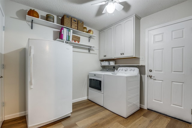 508 Fox Trl, Greenville, TX 75402 - laundry room featuring washing machine and dryer, a ceiling fan, light wood finished floors, cabinet space, and a textured ceiling