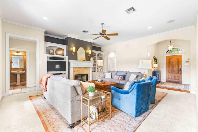 118 Royal Springs Ln, Crawford, TX 76638 - living room featuring light colored carpet, ceiling fan, built in features, a tile fireplace, and baseboards