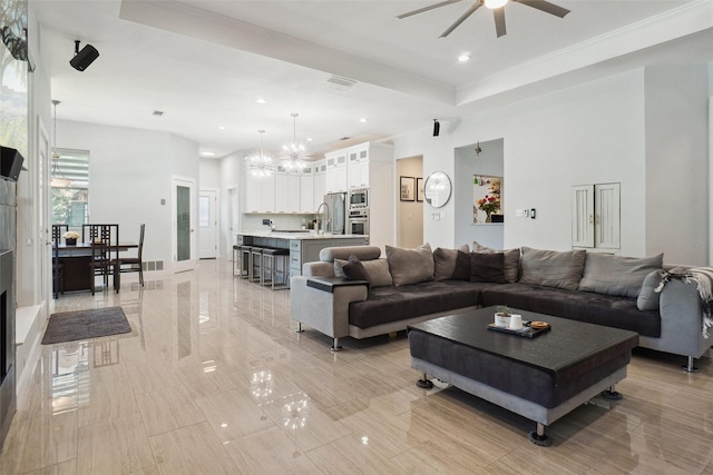 1302 Kelly Green Ct, Keller, TX 76248 - living area featuring a raised ceiling, a ceiling fan, recessed lighting, and a chandelier