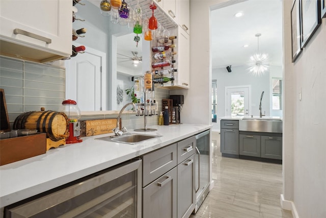 1302 Kelly Green Ct, Keller, TX 76248 - kitchen with a sink, gray cabinets, beverage cooler, and recessed lighting